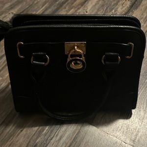 Black fake leather bag , barely used , comes with cross body strap